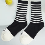 Load image into Gallery viewer, MID-LENGTH BLACK &amp; WHITE STRIPED SMILEY SOCKS
