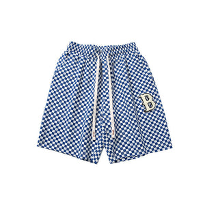 ALLOVER PLAID PATCHWORK SHORTS
