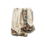 Load image into Gallery viewer, PANELED EMBROIDERED KNEE SHORTS
